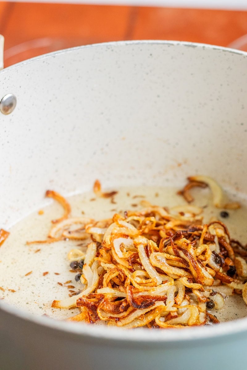 bronzing onions for chana pulao in a pot