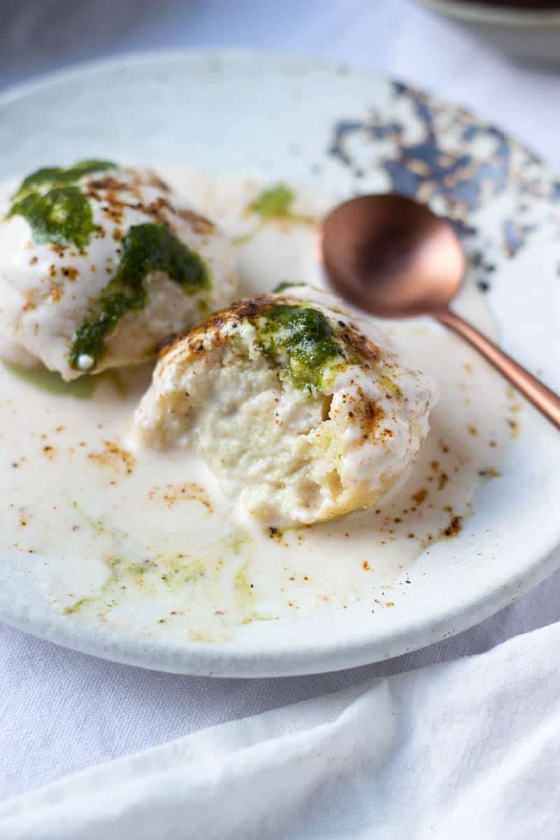a Plate of Dahi Baray with a bite taken out