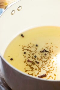 whole spices added to oil for aloo gosht