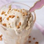 A cup of no churn coffee toffee ice cream with toffee bits