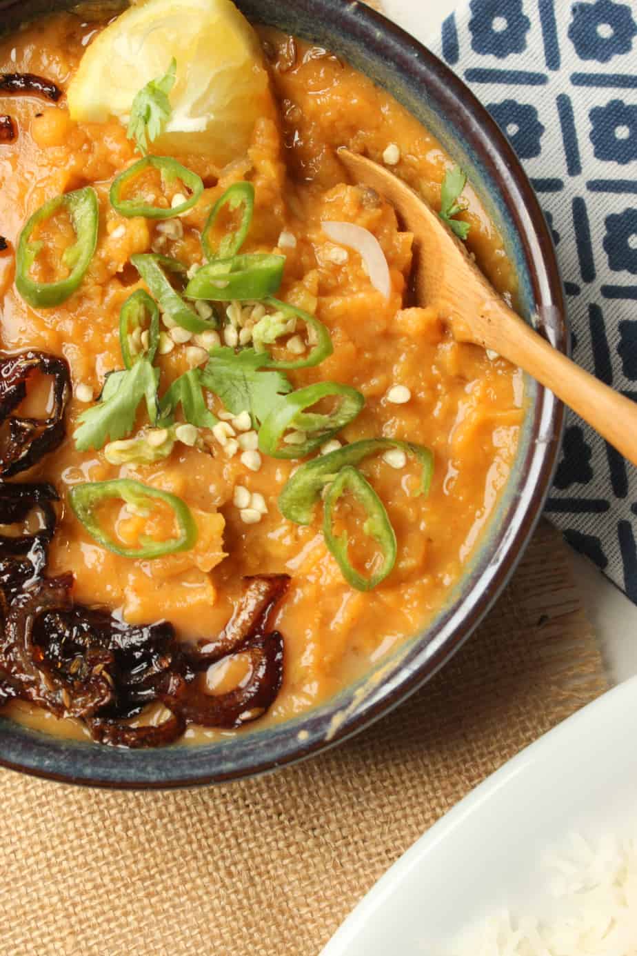 chanay ki daal garnished with caramelized onions and fresh chilies