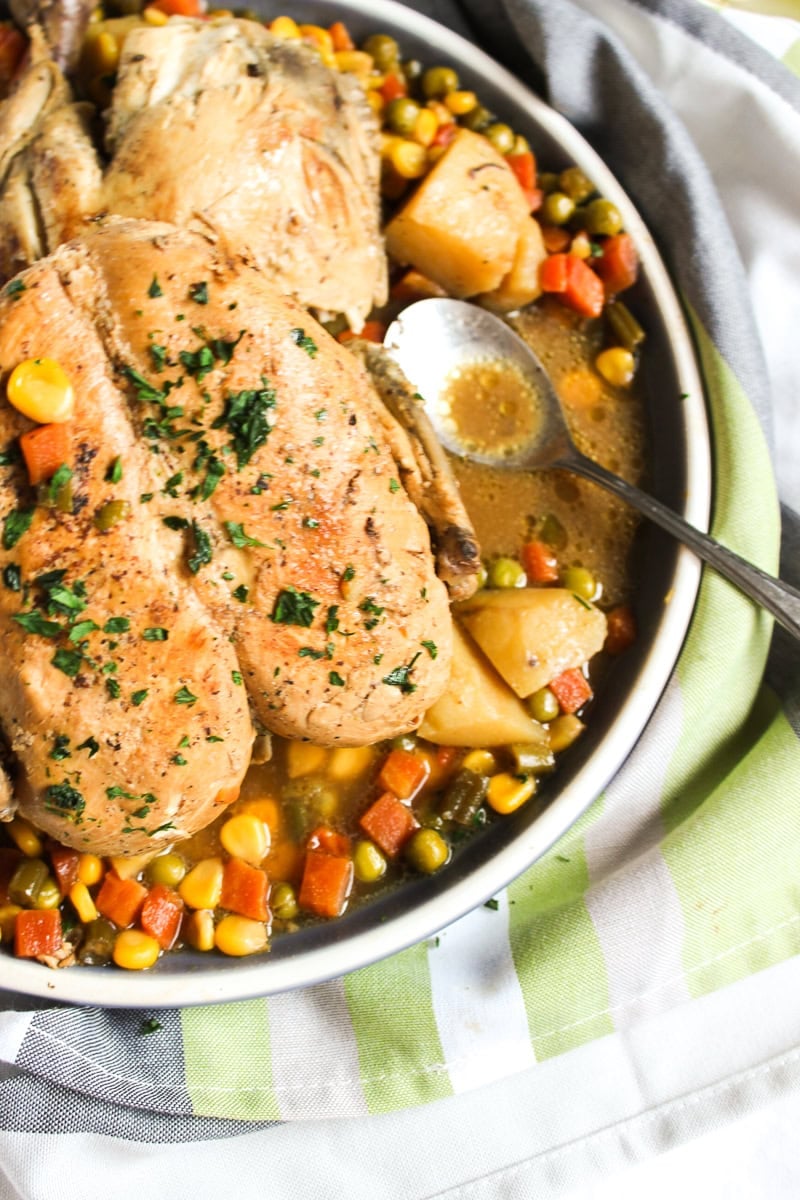 a platter with the stovetop lemon roast and a spoon