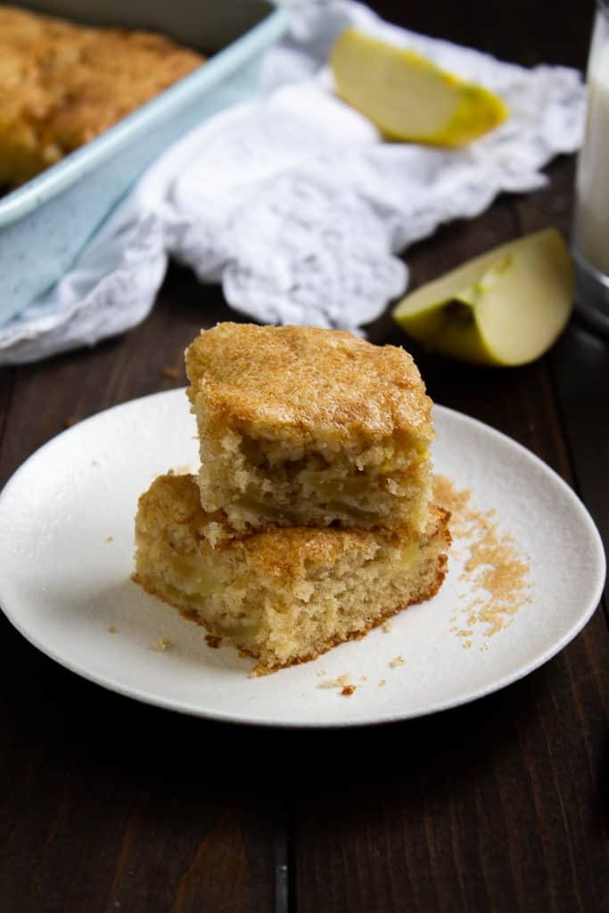 Two pieces of Apple Cake stacked on a plate