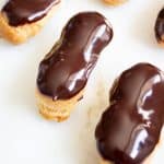 Three eclairs on a marble surface