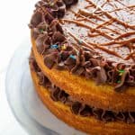 three quarters of a vanilla cake with chocolate buttercream