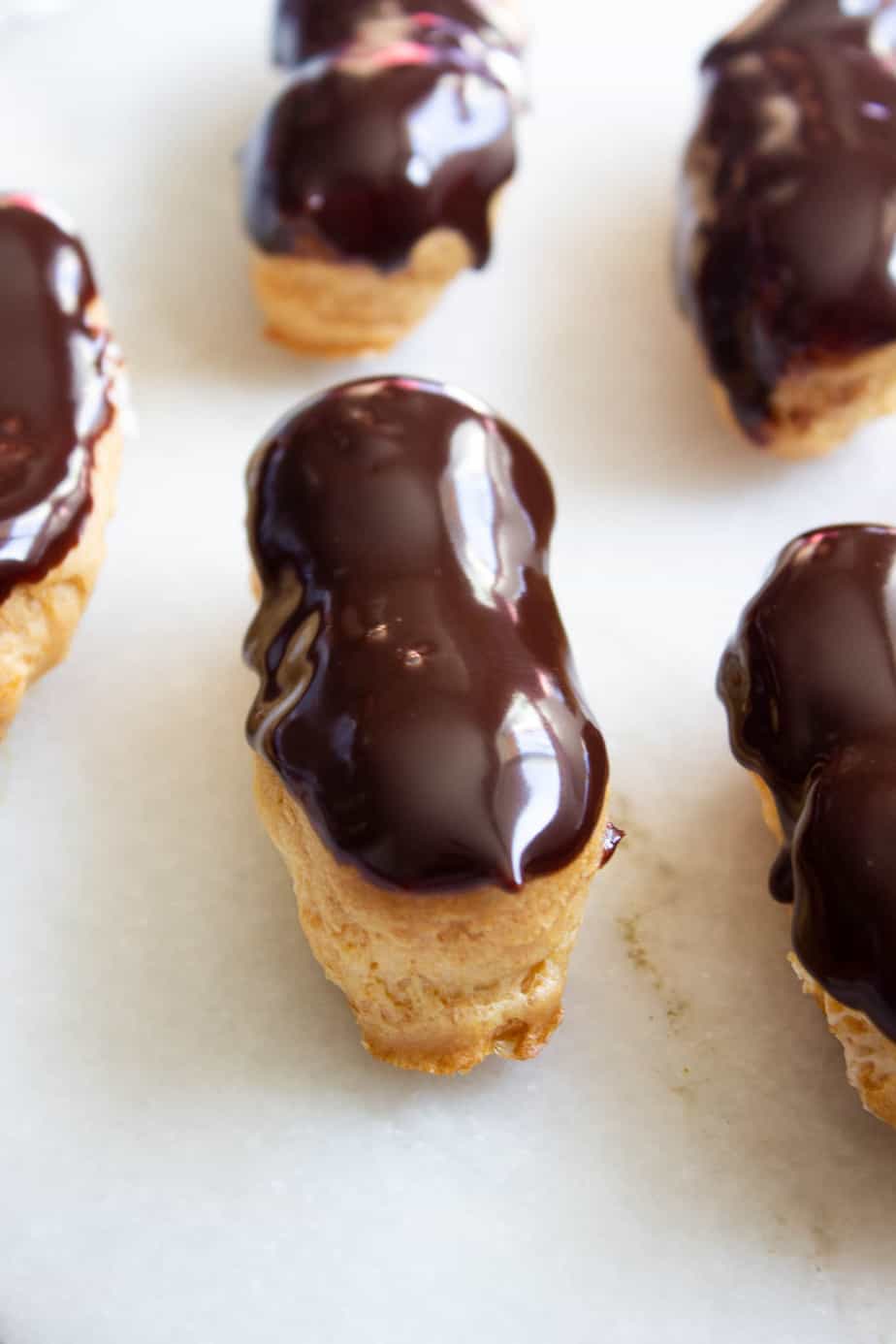 Eclairs, one full and four partial