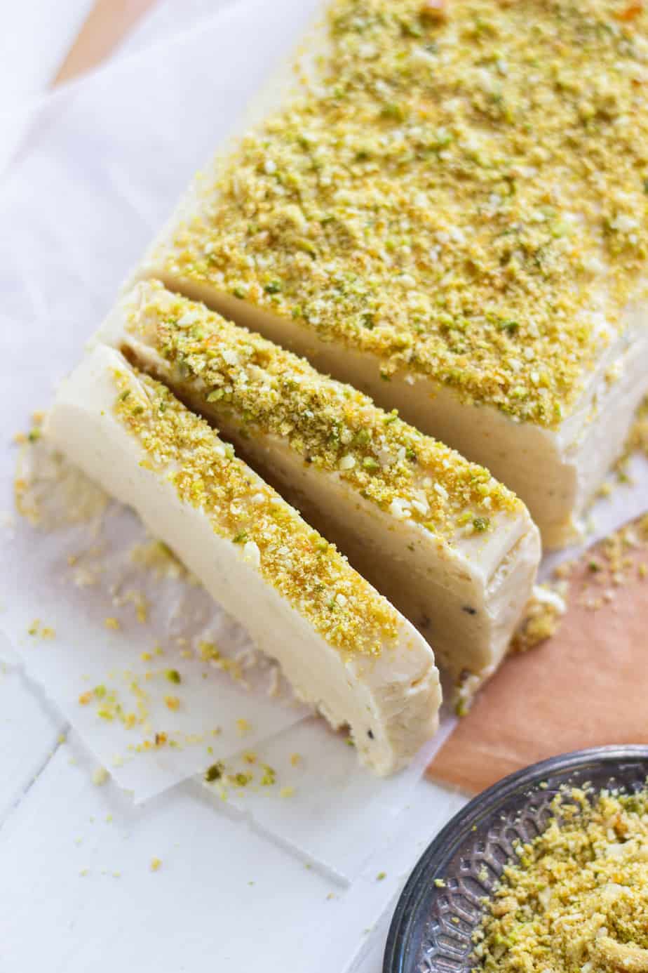 A ยพ shot of frozen Kulfi partially sliced