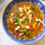 a bowl of hot and sour soup top down