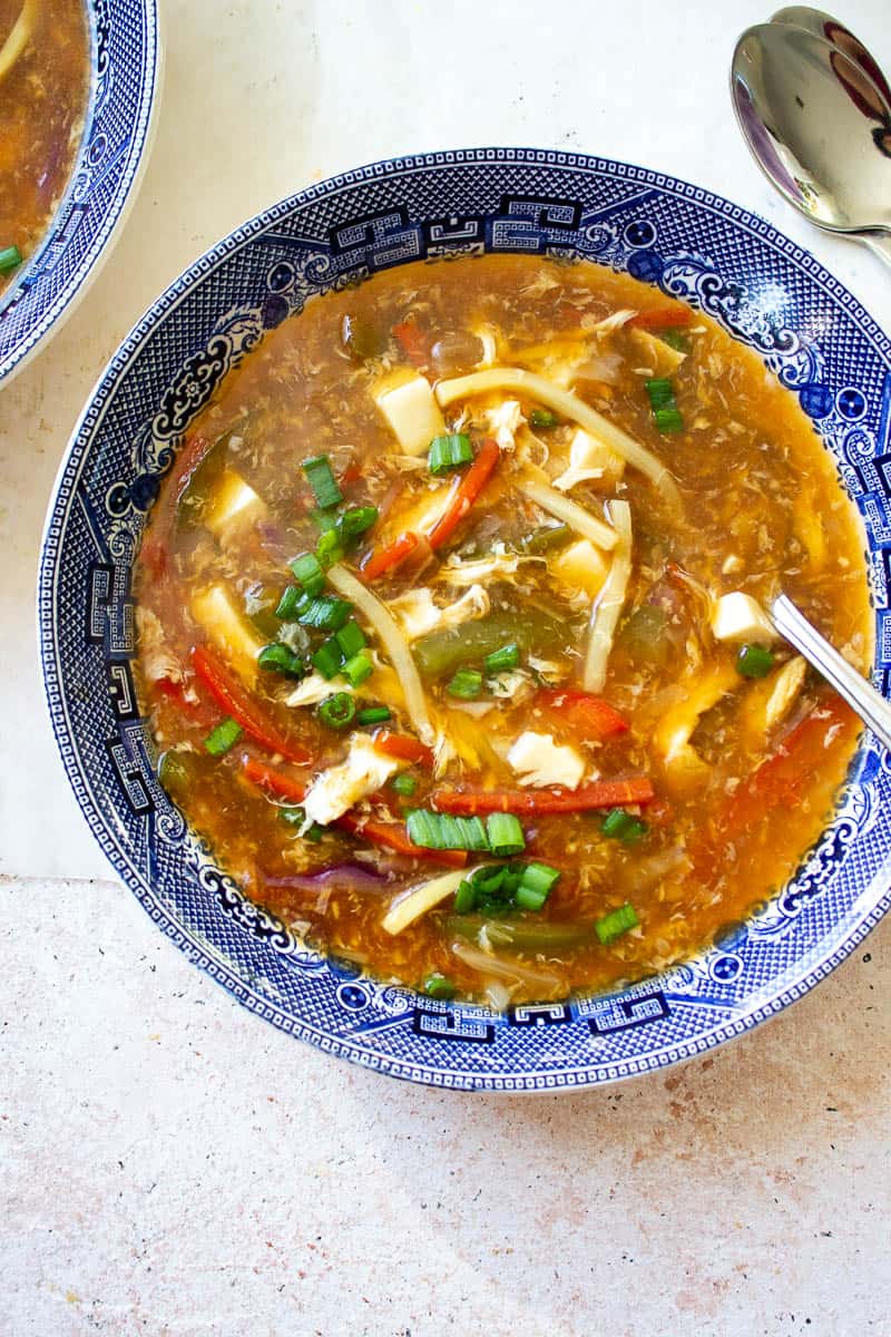 a bowl of hot and sour soup top down