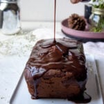 Glaze being poured on to a Chocolate Loaf Cake