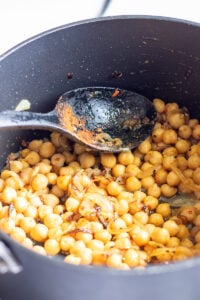 chanay for poori in a pot after the spices are added