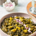 Quicker Aloo Palak in a pink dish