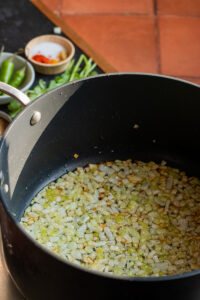 onions in a pot, diced and golden edges