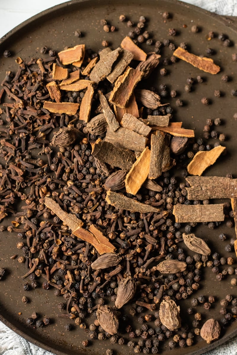 An image of the whole spices that go in this Pakistani Garam Masala on a pan