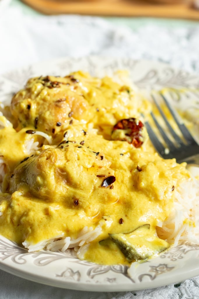kadhi pakoda on a plate with rice