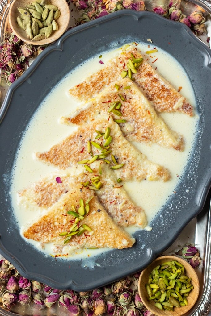 Shahi tukray dish, top down, on a silver tray with rosebuds.