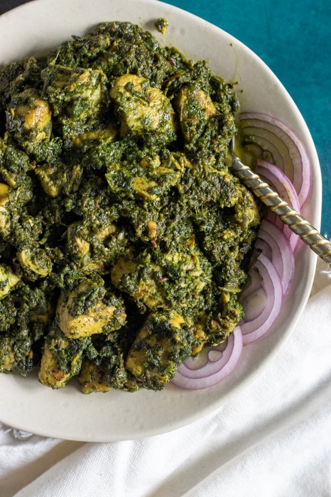 top down view of a plate of palak chicken or murgh palak