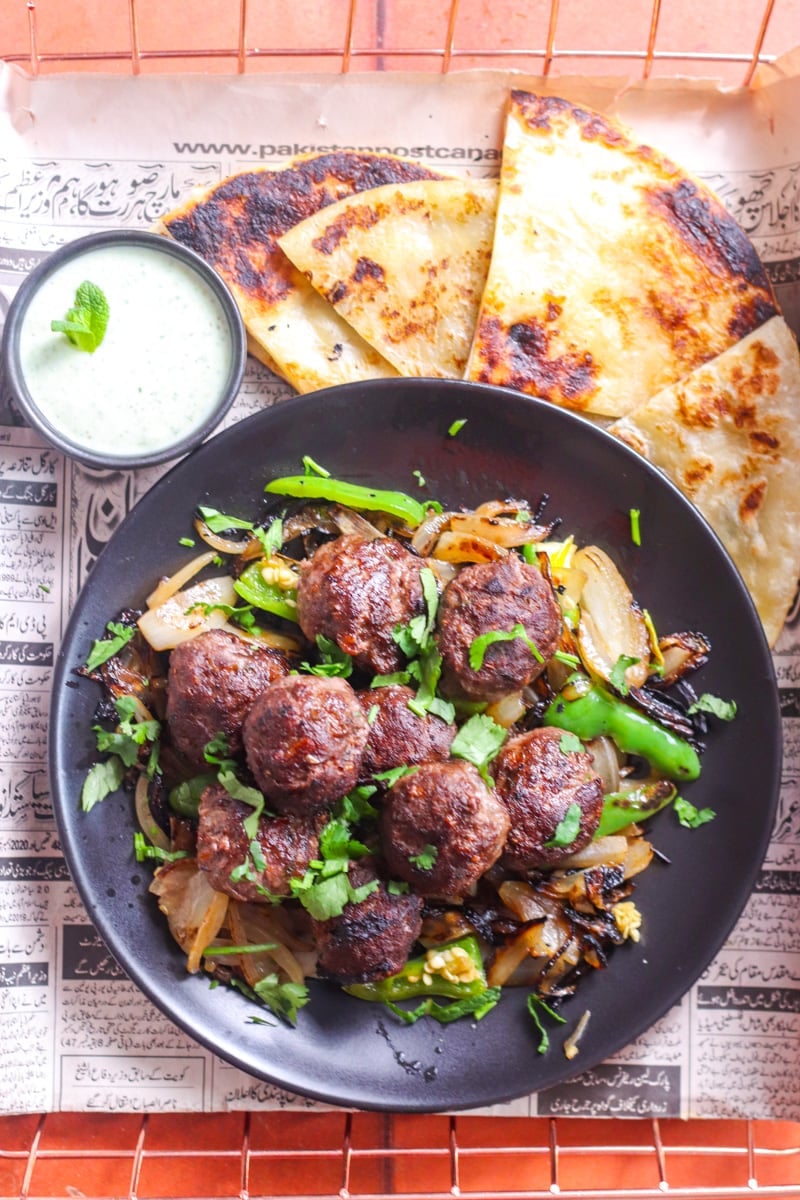 gola kabab, chutney, paratha, onions.