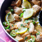 ¾ view of murgh kaali mirch with lemon