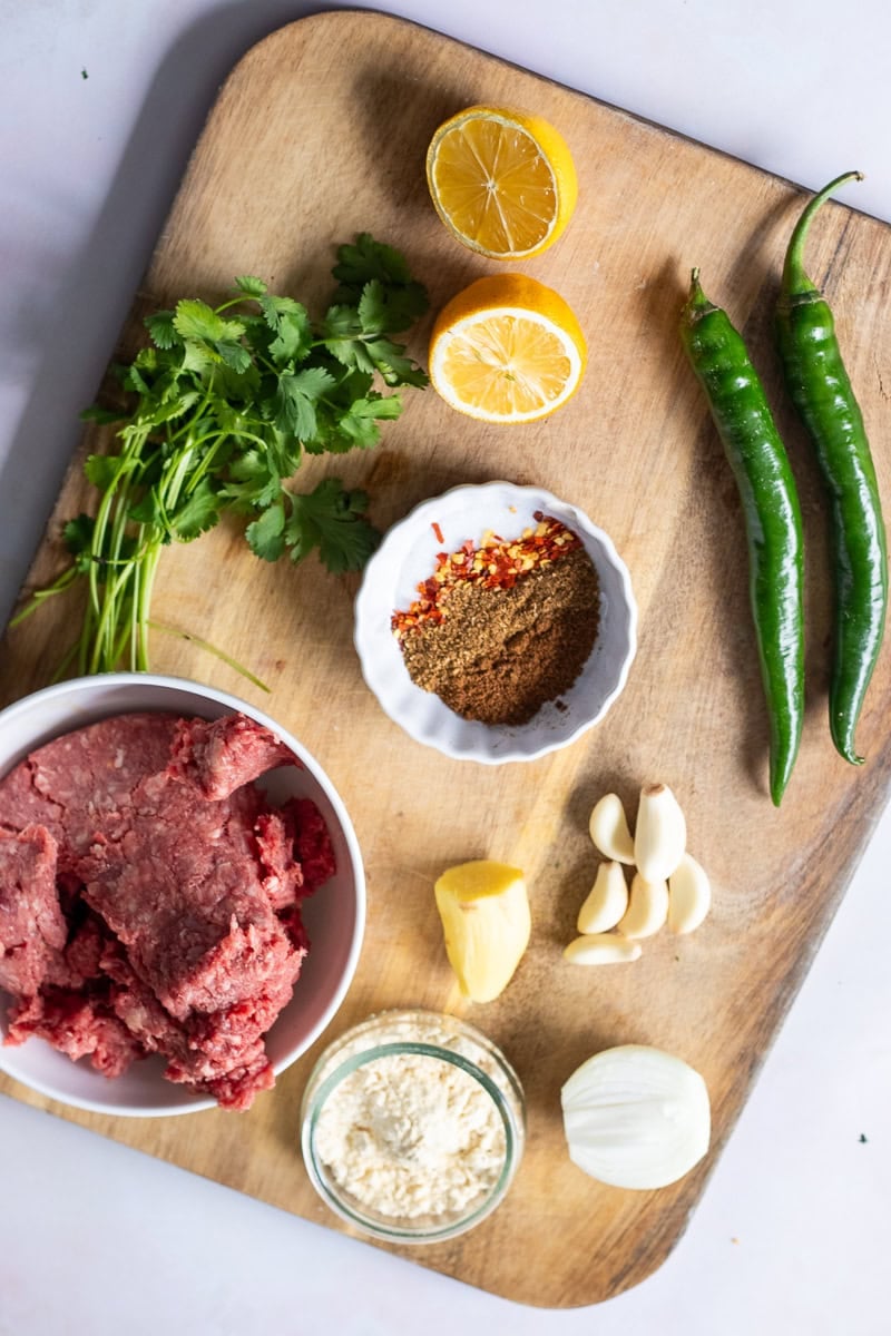 handi kabab ingredients on a wooden chopping board