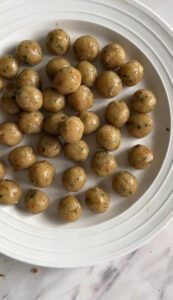 a plate of mini koftas prepped for kofta pulao or moti pulao