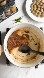 pot of softened onion masala for pulao